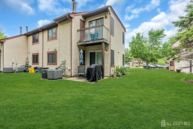 503 Samuel Ct, South Brunswick, NJ 08810 - rear view of house with a balcony, a yard, and central AC