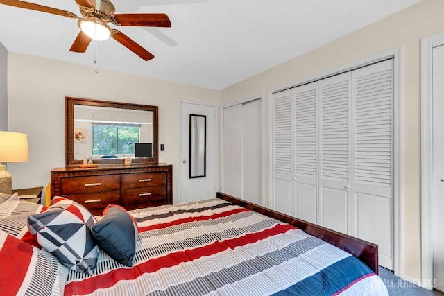 bedroom featuring two closets and ceiling fan