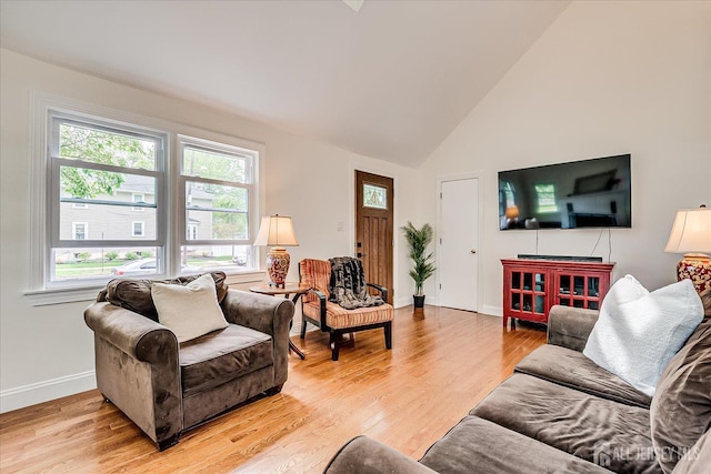 61 Thomas St, Metuchen, NJ 08840 - living room featuring baseboards, light wood-type flooring, and high vaulted ceiling