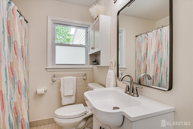61 Thomas St, Metuchen, NJ 08840 - bathroom featuring toilet, baseboards, tile patterned flooring, and vanity
