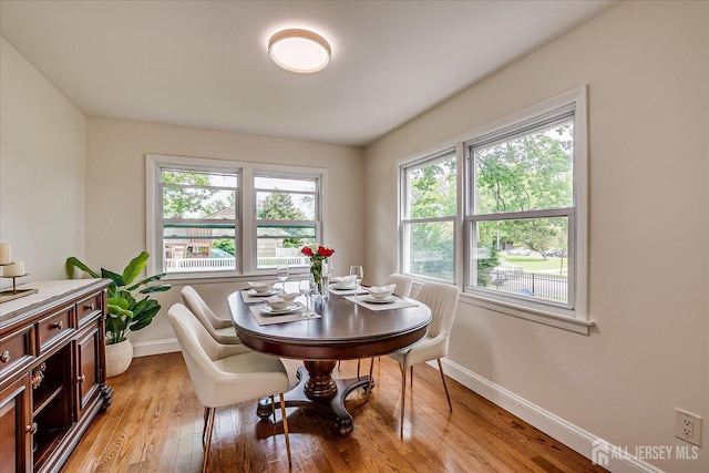 61 Thomas St, Metuchen, NJ 08840 - dining room featuring baseboards, healthy amount of natural light, and light wood finished floors