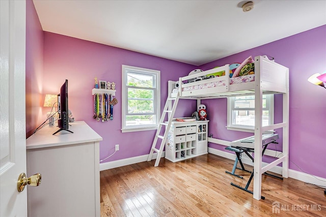 61 Thomas St, Metuchen, NJ 08840 - bedroom with light wood-style floors and baseboards