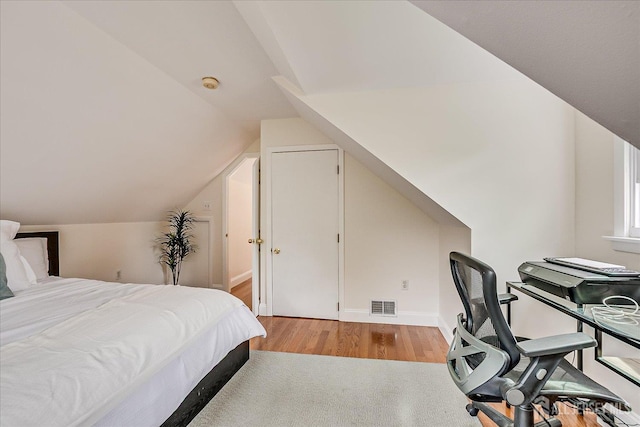 61 Thomas St, Metuchen, NJ 08840 - bedroom with light wood-style flooring, vaulted ceiling, and baseboards