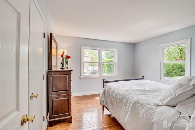 61 Thomas St, Metuchen, NJ 08840 - bedroom with light wood-style floors and baseboards