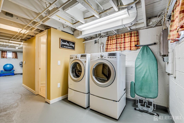 61 Thomas St, Metuchen, NJ 08840 - washroom with washer and clothes dryer and baseboards