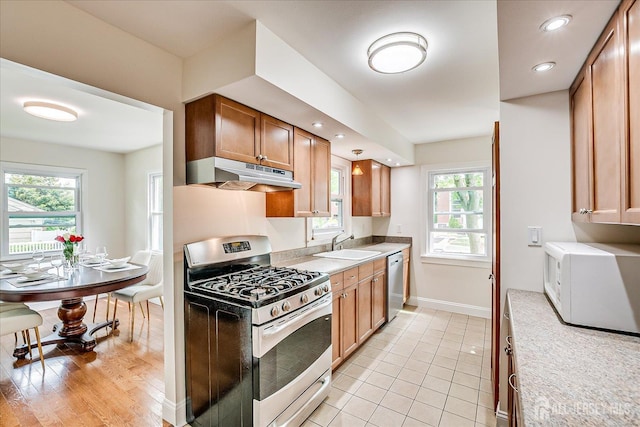 61 Thomas St, Metuchen, NJ 08840 - kitchen with appliances with stainless steel finishes, under cabinet range hood, a sink, and light countertops