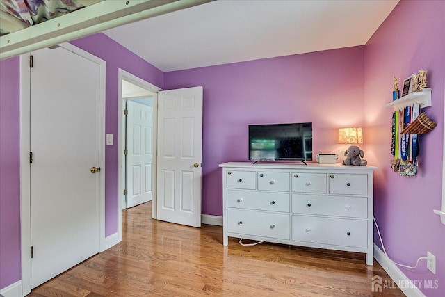 61 Thomas St, Metuchen, NJ 08840 - bedroom with light wood-type flooring and baseboards