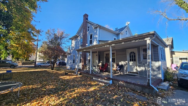 exterior space featuring covered porch and a trampoline