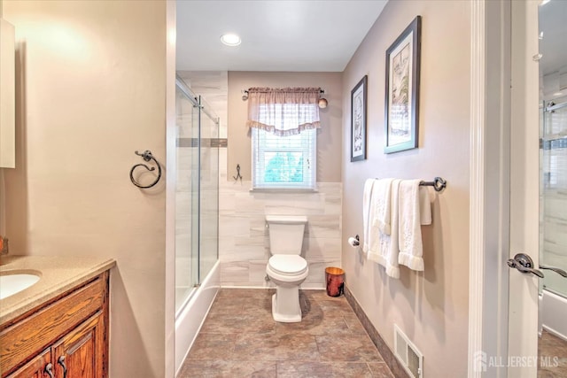 7 Mill Rd, Jamesburg, NJ 08831 - full bath with toilet, a shower with shower door, vanity, tile walls, and recessed lighting