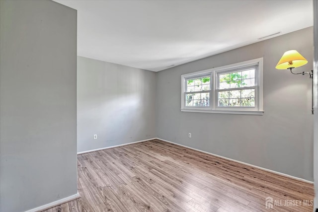 7 Mill Rd, Jamesburg, NJ 08831 - unfurnished room with wood finished floors and baseboards