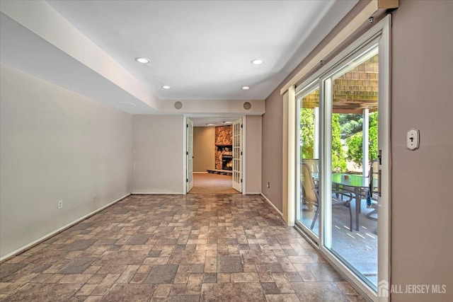 7 Mill Rd, Jamesburg, NJ 08831 - spare room featuring baseboards, a fireplace, stone tile flooring, and recessed lighting