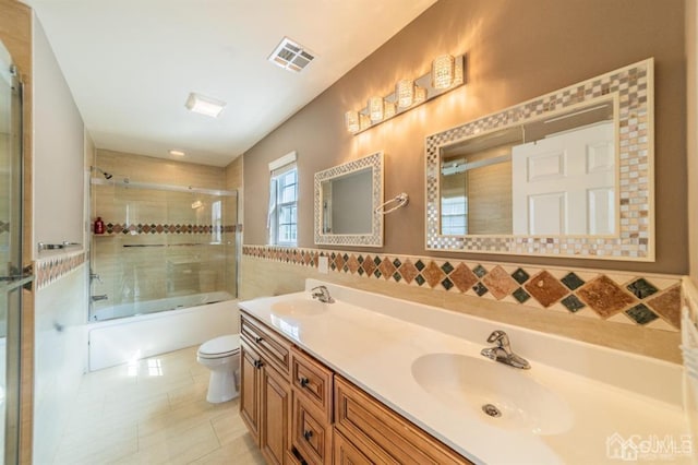 58 S Whittier St, Carteret, NJ 07008 - bathroom featuring a sink, toilet, double vanity, and visible vents