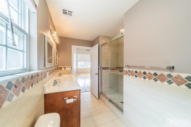 58 S Whittier St, Carteret, NJ 07008 - bathroom featuring tile patterned floors, visible vents, a shower stall, and plenty of natural light