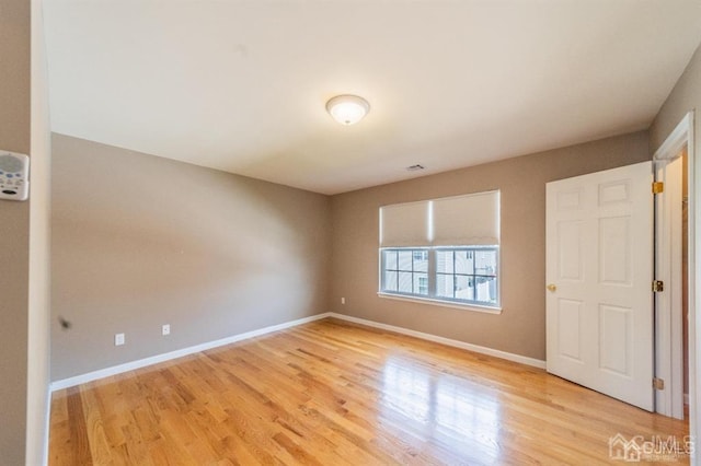 58 S Whittier St, Carteret, NJ 07008 - unfurnished room featuring baseboards, light wood finished floors, and visible vents