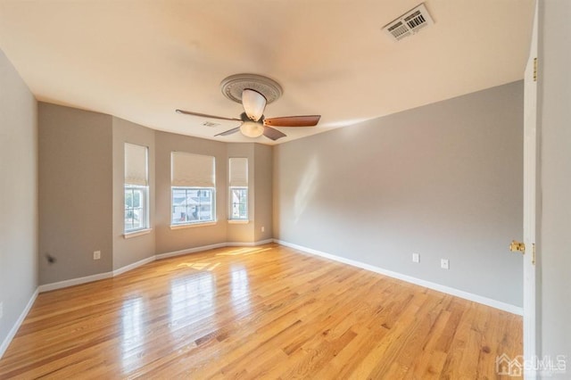 58 S Whittier St, Carteret, NJ 07008 - empty room featuring baseboards, ceiling fan, light wood-style flooring, and visible vents