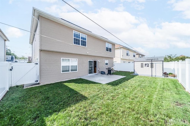 58 S Whittier St, Carteret, NJ 07008 - back of property featuring a lawn, a patio, a gate, and a fenced backyard