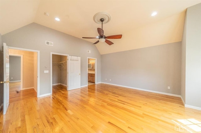 58 S Whittier St, Carteret, NJ 07008 - unfurnished bedroom with light wood-style floors, a walk in closet, vaulted ceiling, and visible vents