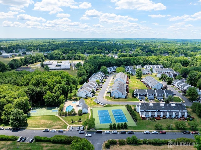 bird's eye view featuring a forest view and a residential view