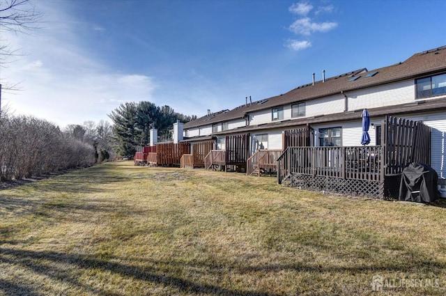 view of yard featuring a wooden deck