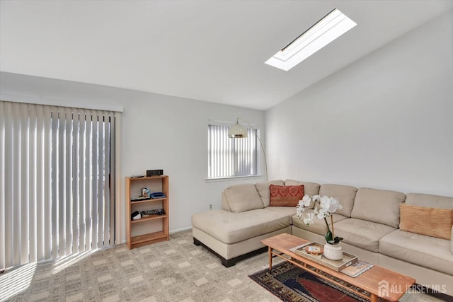 living room with lofted ceiling with skylight and carpet floors