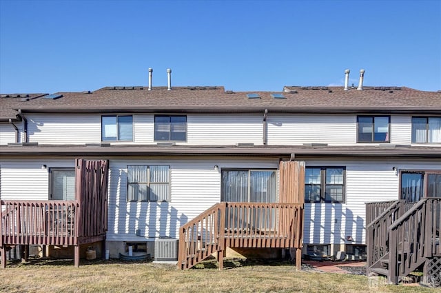 back of house featuring a wooden deck, central AC, and a shingled roof