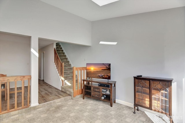 interior space with baseboards and carpet