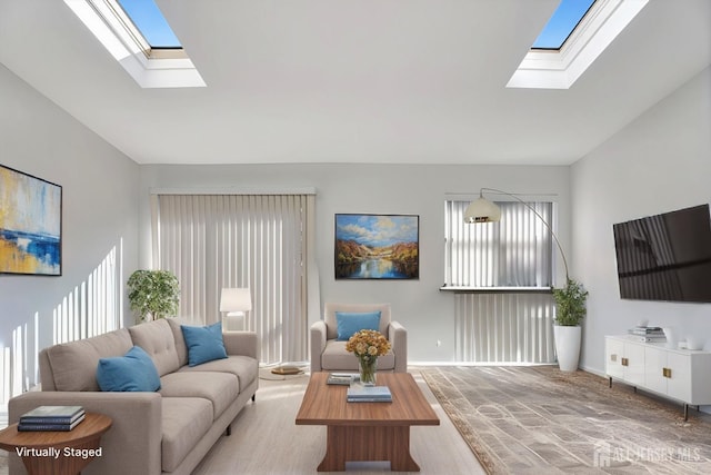 living area with lofted ceiling with skylight and baseboards