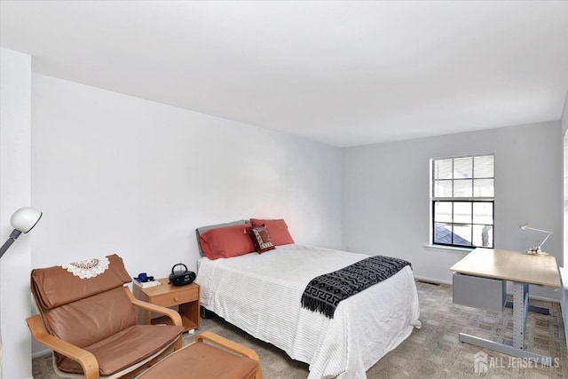 carpeted bedroom featuring visible vents and baseboards