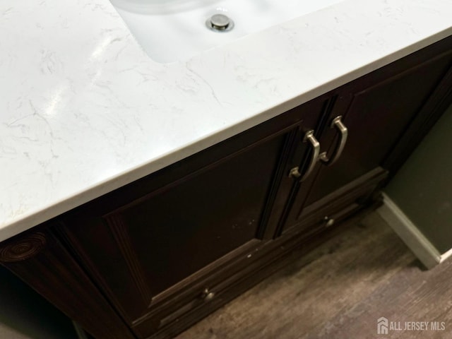 detailed view of wood finished floors and baseboards
