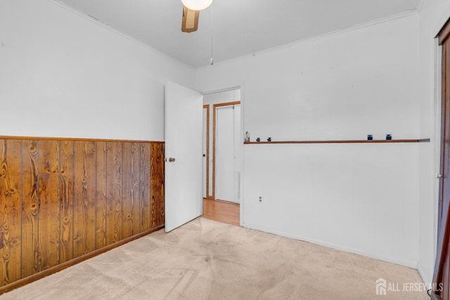 49 Charles Ter, Piscataway, NJ 08854 - carpeted empty room featuring ceiling fan, wooden walls, and crown molding