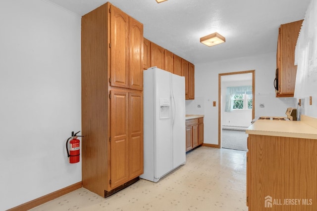 49 Charles Ter, Piscataway, NJ 08854 - kitchen with white refrigerator with ice dispenser, range, light floors, light countertops, and black microwave