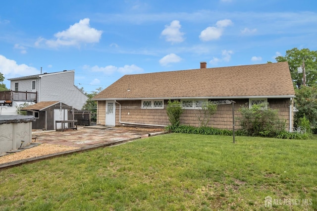 49 Charles Ter, Piscataway, NJ 08854 - rear view of house featuring a storage shed, a chimney, a shingled roof, and a patio