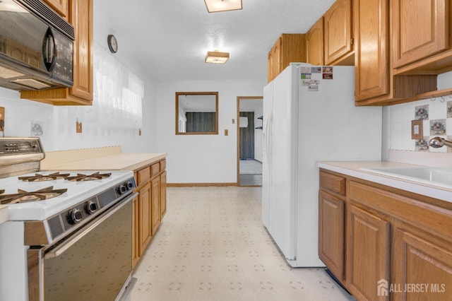 49 Charles Ter, Piscataway, NJ 08854 - kitchen featuring white appliances, light flooring, light countertops, decorative backsplash, and brown cabinets
