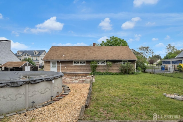 49 Charles Ter, Piscataway, NJ 08854 - back of property with a shingled roof