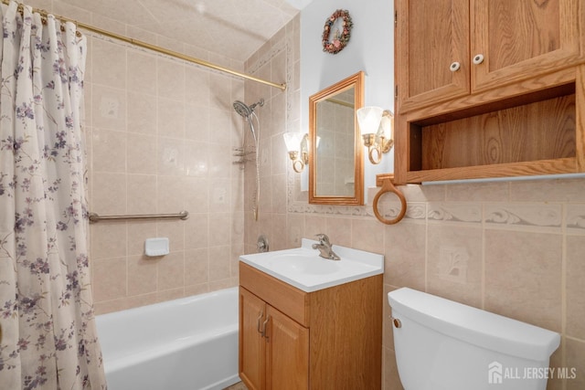 49 Charles Ter, Piscataway, NJ 08854 - bathroom featuring vanity, shower / bath combo with shower curtain, and tile walls