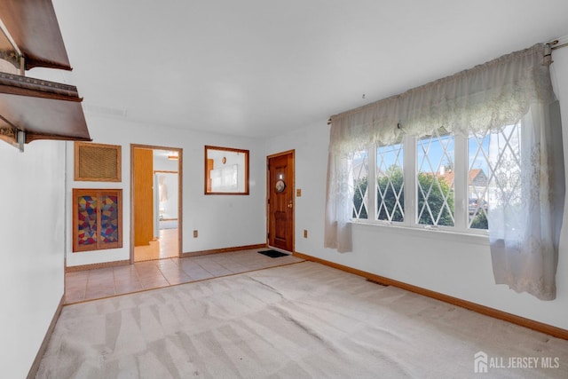 49 Charles Ter, Piscataway, NJ 08854 - carpeted foyer featuring baseboards and tile patterned floors