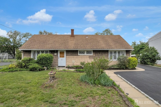 49 Charles Ter, Piscataway, NJ 08854 - view of front of home with a front yard and roof with shingles
