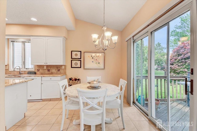 35 Brighton Ct, Monroe, NJ 08831 - dining room with light tile patterned floors, lofted ceiling, and a chandelier