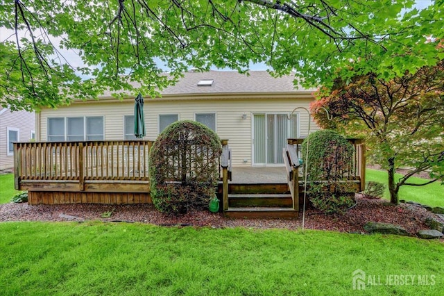 35 Brighton Ct, Monroe, NJ 08831 - rear view of house featuring a deck and a lawn