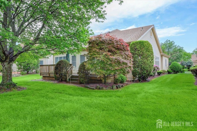 35 Brighton Ct, Monroe, NJ 08831 - rear view of property featuring a lawn and a deck