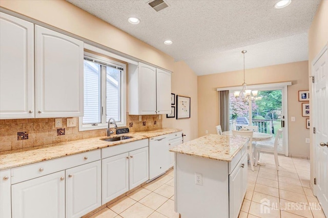 35 Brighton Ct, Monroe, NJ 08831 - kitchen with a sink, dishwasher, backsplash, a chandelier, and lofted ceiling