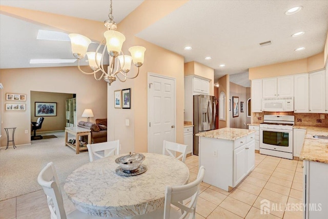 35 Brighton Ct, Monroe, NJ 08831 - dining space with light tile patterned floors, recessed lighting, a chandelier, and baseboards