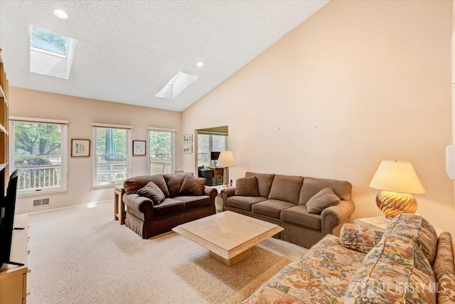 35 Brighton Ct, Monroe, NJ 08831 - living room featuring a skylight, carpet flooring, a textured ceiling, lofted ceiling, and recessed lighting