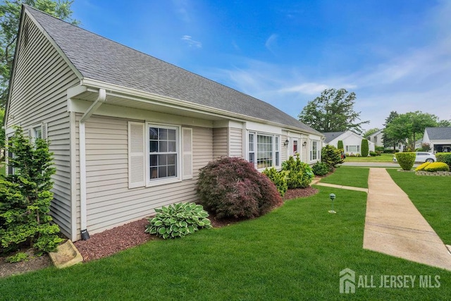 539 Old Nassau Rd Unit B, Monroe, NJ 08831 - view of property exterior with a shingled roof and a lawn