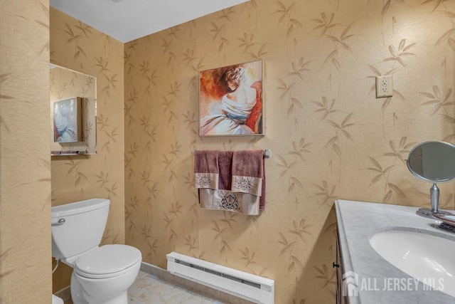 539 Old Nassau Rd Unit B, Monroe, NJ 08831 - half bathroom with a baseboard radiator, wallpapered walls, vanity, toilet, and baseboards