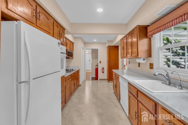 539 Old Nassau Rd Unit B, Monroe, NJ 08831 - kitchen with white appliances, a sink, light countertops, brown cabinets, and recessed lighting