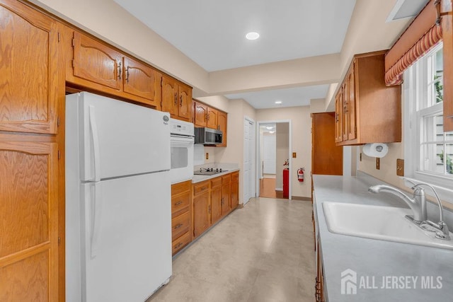 539 Old Nassau Rd Unit B, Monroe, NJ 08831 - kitchen featuring white appliances, a sink, light countertops, and brown cabinets
