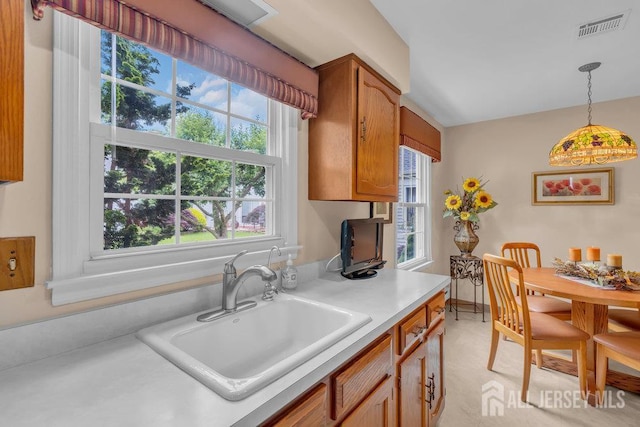 539 Old Nassau Rd Unit B, Monroe, NJ 08831 - kitchen featuring a sink, light countertops, healthy amount of natural light, and hanging light fixtures