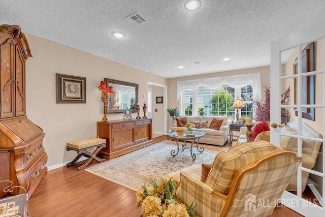 539 Old Nassau Rd Unit B, Monroe, NJ 08831 - living area with a textured ceiling, light wood finished floors, baseboards, and recessed lighting