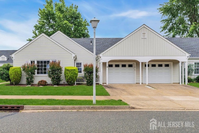 539 Old Nassau Rd Unit B, Monroe, NJ 08831 - view of front of home featuring an attached garage, driveway, a front yard, and a shingled roof